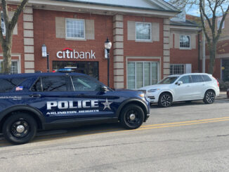 Arlington Heights police at the scene where a bicyclist was hit by an SUV, Friday, April 28, 2023 in downtown Arlington Heights