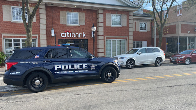 Arlington Heights police at the scene where a bicyclist was hit by an SUV, Friday, April 28, 2023 in downtown Arlington Heights