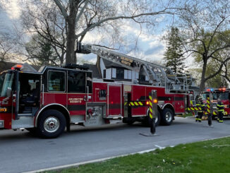 Tower 1 and Engine 2 at the front of our house with a small fire inside