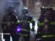 Firefighters forcing entry at the back door of a business on Northwest Highway in Palatine on Saturday, April 22, 2023 (CARDINAL NEWS)
