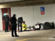 Paramedics apparently getting a signed medical release from a man who camped out in the southeast corner of the underground parking garage at 33 South Evergreen Avenue in Arlington Heights