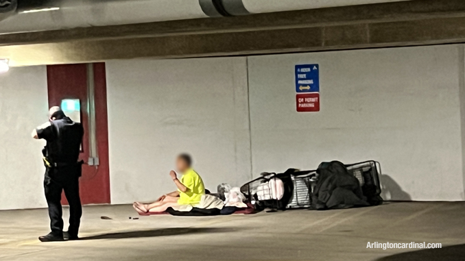 A police officer begins to gather facts at the scent of an alleged hatchet attack in the underground parking garage at 33 South Evergreen Avenue in Arlington Heights on Sunday morning  April 16, 2023