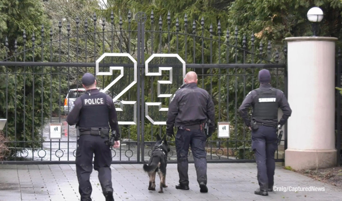 Police with K-9 enter Michael Jordan's former residence to investigate a report of a burglary (Craig/CapturedNews)