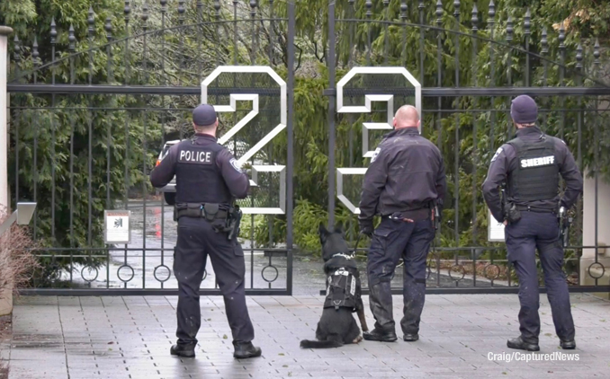 Police with K-9 enter Michael Jordan's former residence to investigate a report of a burglary (Craig/CapturedNews)