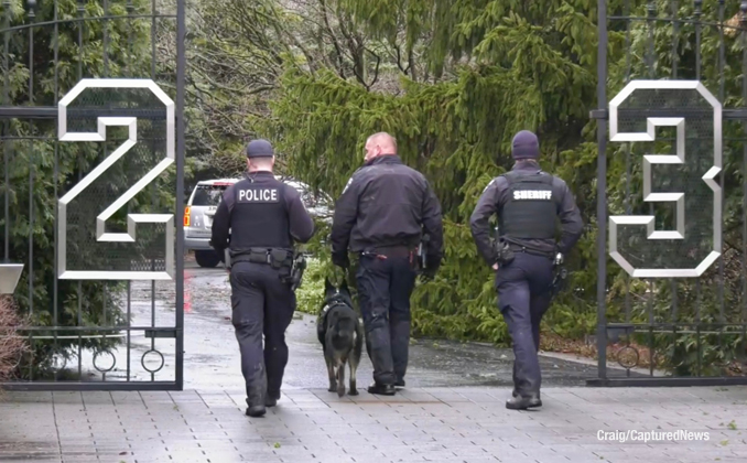 Police with K-9 enter Michael Jordan's former residence to investigate a report of a burglary (Craig/CapturedNews)