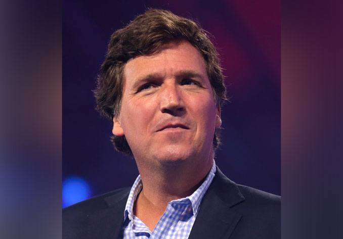 Tucker Carlson speaking with attendees at the 2022 AmericaFest at the Phoenix Convention Center in Phoenix, Arizona (PHOTO CREDIT: Gage Skidmore).