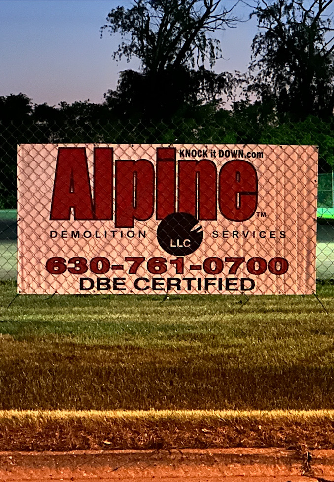 Alpine Demolition Services banner near a Euclid Avenue entrance near the former Ditka's Trackside restaurant (CARDINAL NEWS).