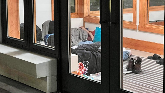 Four people camped out in the Arlington Heights police station vestibule overnight in early May, 2023.