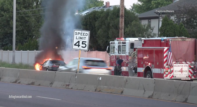 Arlington Heights Engine 4's crew extinguishing a car fire involving a Toyota Camry on Palatine Road west of Windsor Drive in Arlington Heights, Tuesday, May 30, 2023