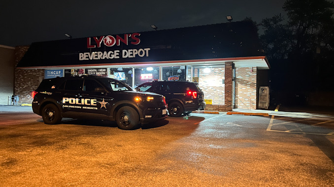 Police standing by in front of Lyons Beverage Depot, 135 South Arlington Heights Road in Arlington Heights after burglary occurred at Elm's Liquors on Northwest Highway about a mile away