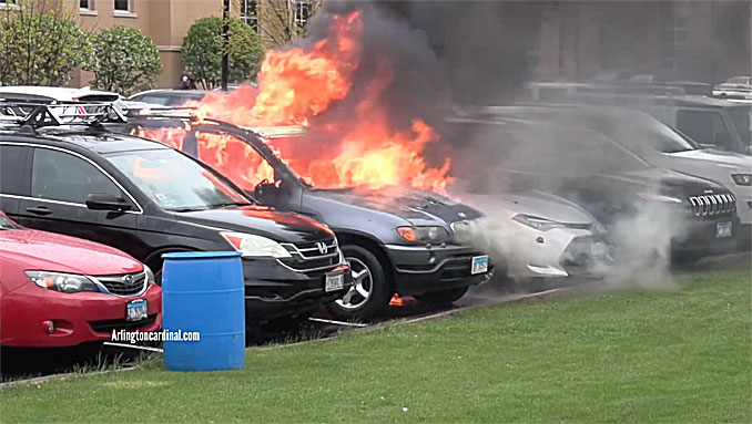 Two vehicles on fire at a parking lot at Saint Viator on Monday, May 1, 2023