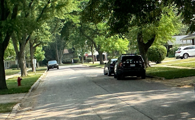 Police on the street on Adams Street in Rolling Meadows, where a burglar kicked in the back door while at least one resident was home in the afternoon, Wednesday, June 28, 2023