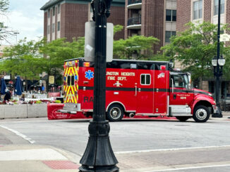 Arlington Heights Fire Department paramedics on the scene at Davis Street and Vail Avenue where a person was injured by an umbrella while high wind gust were occurring