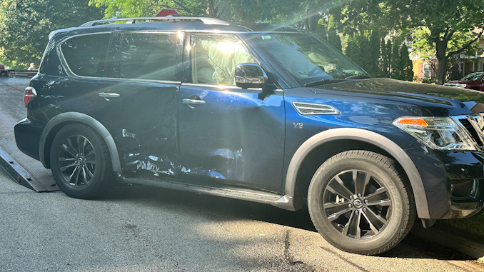 Collision damage on the passenger side of a blue Nissan Armada after a T-bone style crash at Euclid Avenue and Haddow Avenue in Arlington Heights on Monday, June 19, 2023 (CARDINAL NEWS)