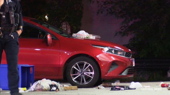 Kia Forte with a damaged passenger mirror at the scene of a fight with injuries at the Mobil gas station 102 West Northwest Highway in Arlington Heights, Thursday, July 6, 2023 (CARDINAL NEWS)