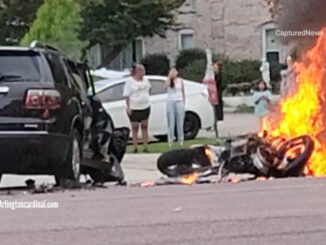 A motorcycle burns after a crash with a GMC SUV just before police arrived on Thursday, July 13, 2023 about 7:12 p.m. (VIDEO IMAGE CREDIT: George Young)