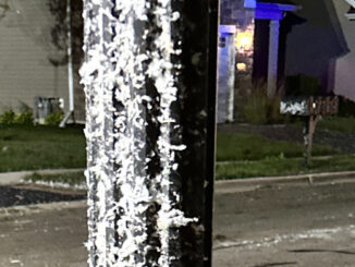 Lamp post plastered by insulation and/or pulverized drywall (sheetrock) material in the Edgewater by Del Webb neighborhood in Elgin (CARDINAL NEWS)