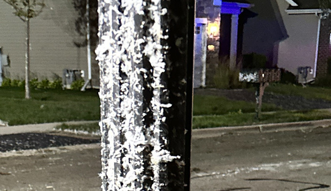 Lamp post plastered by insulation and/or pulverized drywall (sheetrock) material in the Edgewater by Del Webb neighborhood (CARDINAL NEWS)