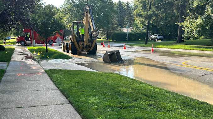 Excavation about to begin while Arlington Heights Public Works Department crews repair a water main break on westbound Euclid Avenue between Dryden Avenue and Arlington Heights Road Saturday morning, July 29, 2023.