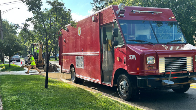 Arlington Heights Public Works water department truck on scene while crews repair a water main break on westbound Euclid Avenue between Dryden Avenue and Arlington Heights Road