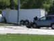 Ford Escape in the foreground and the traffic signal box and the large trailer in the background after a fatal crash in Grayslake on Saturday, July 29, 2023