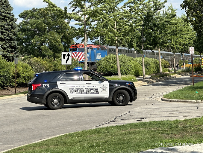 Firefighters on scene of a small fire involving a Metra locomotive in Mount Prospect on Thursday, July 20, 2023 (PHOTO CREDIT: TJ Seputis)