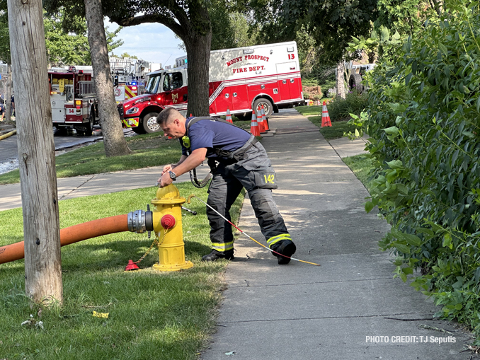 Firefighters on scene of a small fire involving a Metra locomotive in Mount Prospect on Thursday, July 20, 2023 (PHOTO CREDIT: TJ Seputis)