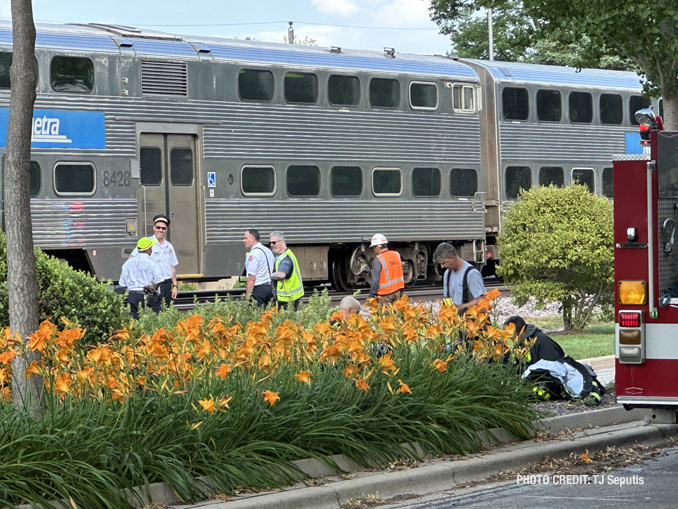 Firefighters on scene of a small fire involving a Metra locomotive in Mount Prospect on Thursday, July 20, 2023 (PHOTO CREDIT: TJ Seputis)