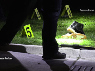 Evidence markers in the front lawn of a townhouse on Queensbury Circle in Hoffman Estates on Wednesday night, August 9, 2023 (CARDINAL NEWS).