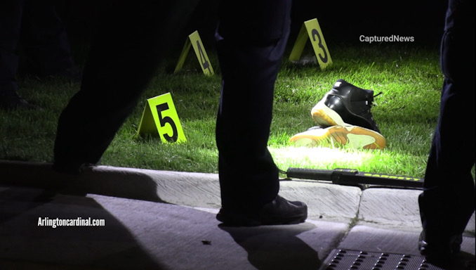 Evidence markers in the front lawn of a townhouse on Queensbury Circle in Hoffman Estates on Wednesday night, August 9, 2023 (CARDINAL NEWS).