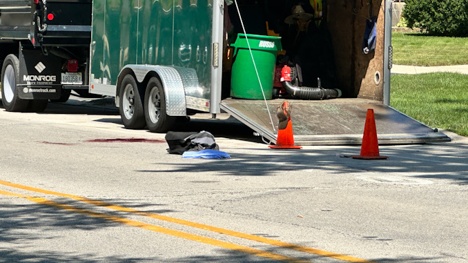 Trailer ramp where a landscaping worker apparently stepped off and was hit by a passing work van on Mount Prospect Road in Des Plaines, Wednesday, August 16, 2023 (CARDINAL NEWS)