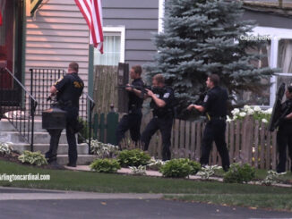 Arlington Heights police officers prepared to enter a home on the south side of Campbell Street just west of downtown Arlington Heights after a 9-1-1 caller reported that he shot his wife on about 7:39 p.m. Saturday, August 5, 2023 (CARDINAL NEWS)