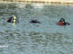 Divers in the water to recover a body at Lake Arlington on Friday, August 4, 2023.