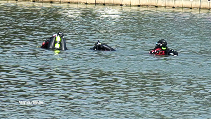 Divers in the water to recover a body at Lake Arlington on Friday, August 4, 2023.