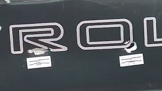 Two bullet holes near the 'R' and 'O' of "CHEVROLET" after a shooting at the Crave bar parking lot July 1, 2023 (Provided photo with source withheld)