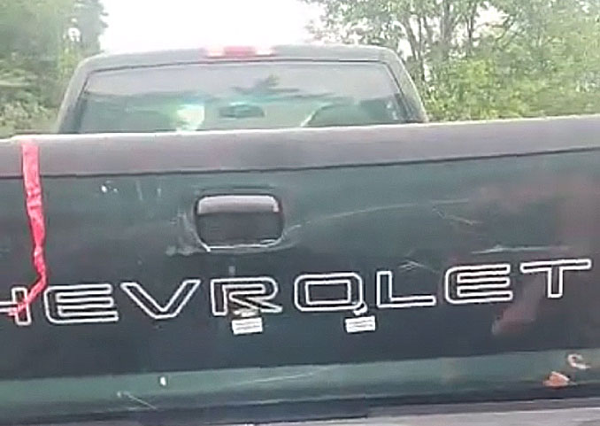 Two bullet holes near the 'R' and 'O' of "CHEVROLET" after a shooting at the Crave bar parking lot July 1, 2023 (Provided photo with source withheld)