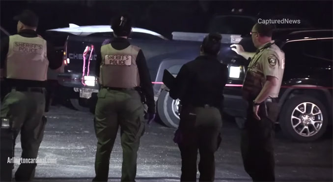 Dark bluish green pickup truck with bullet hole visible near the 'R' of 'CHEVROLET' after a shooting at a bar near Arlington Heights on Saturday, July 1, 2023 (CARDINAL NEWS)