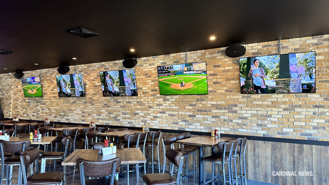 Plenty of TVs on the west wall of the Bird's Nest pub at 11 West Davis Street in Arlington Heights on Wednesday, August 30, 2023 (CARDINAL NEWS)