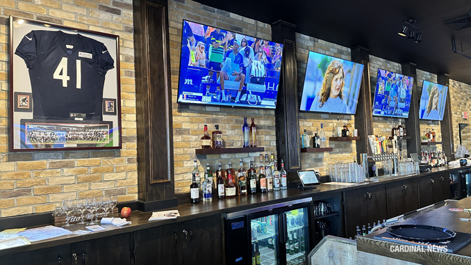 Plenty of TVs on the east wall of the Bird's Nest pub at 11 West Davis Street in Arlington Heights on Wednesday, August 30, 2023 (CARDINAL NEWS)