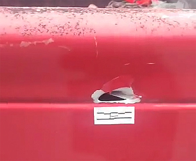 Bullet hole in the tailgate of a red pickup truck after a shooting at the Crave bar parking lot July 1, 2023 (Provided photo with source withheld)