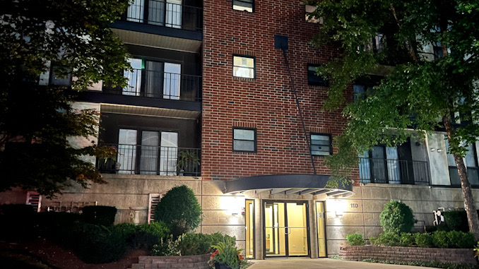 Multi-floor condominium building with a lobby at 110 South Evergreen Avenue in downtown Arlington Heights.