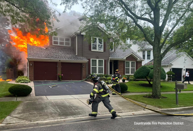 Firefighters and a command officer preparing for fire attack at a house fire on Dearborn Lane in Vernon Hills on Monday, September 11, 2023 (SOURCE: Countryside Fire Protection District)