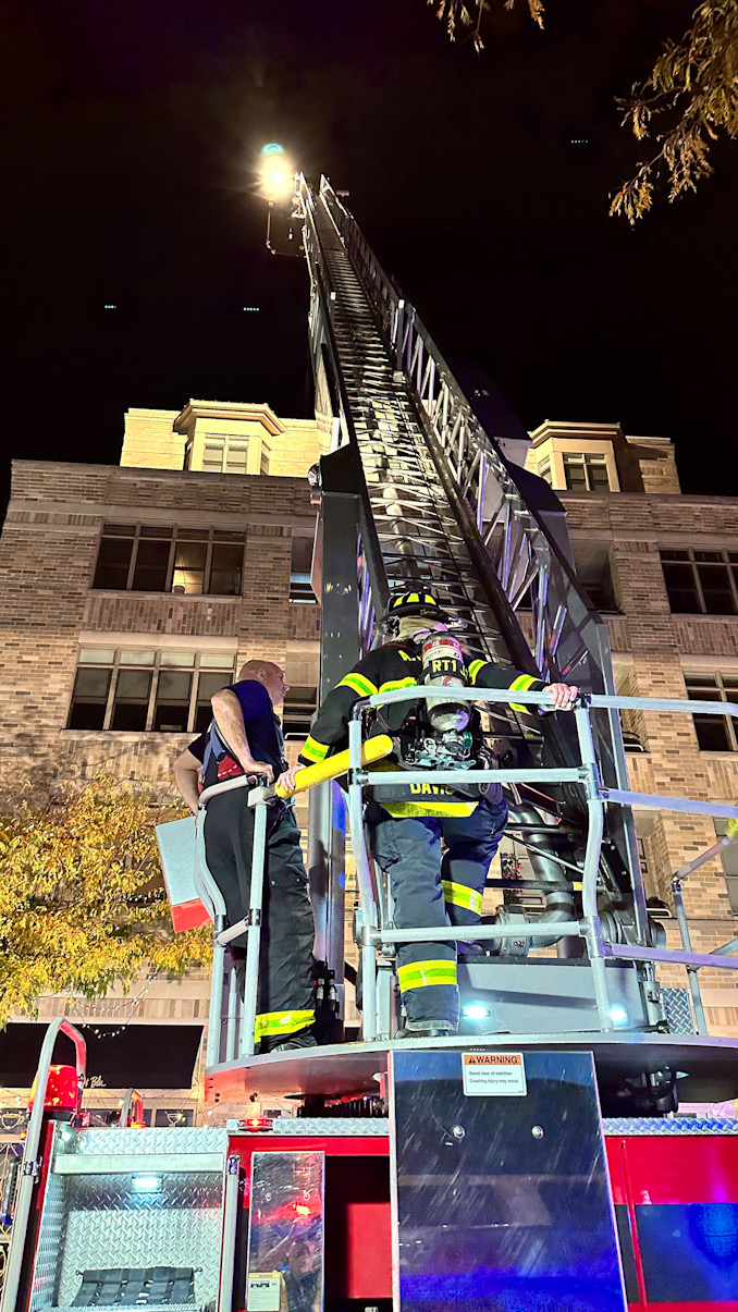Firefighters at the aerial ladder of Tower 1 on Dunton Avenue just south of Campbell Street.