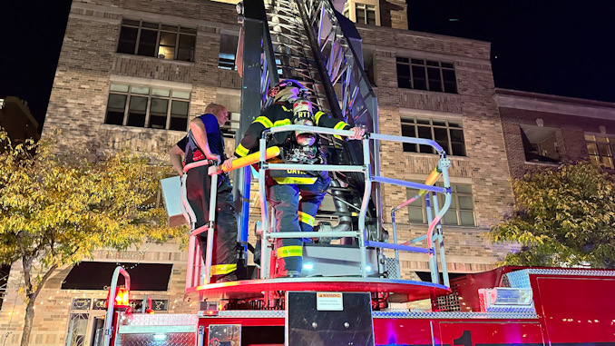 Firefighters at the aerial ladder of Tower 1 on Dunton Avenue.