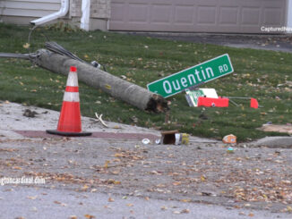 A wood streetlight pole with a street sign snapped at the southwest corner of Quentin Road and Hillside Street in Palatine, October 30, 2023