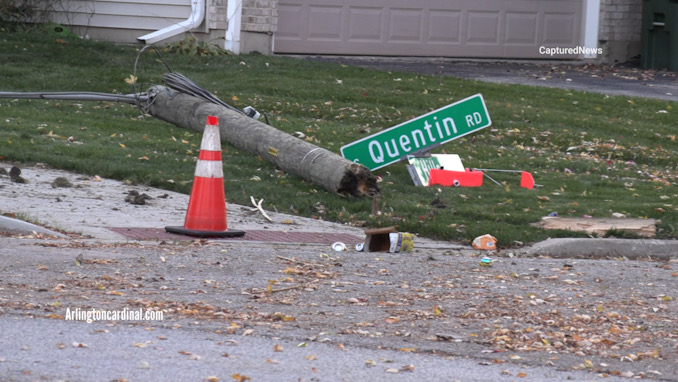 A wood streetlight pole with a street sign snapped at the southwest corner of Quentin Road and Hillside Street in Palatine, October 30, 2023