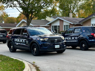 Arlington Heights police officers meeting in the neighborhood S. Central Rd. in west of Arlington Heights Road after a wanted suspect that was possibly armed was in the neighborhood Tuesday, October 24, 2023.