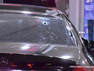 Bullet hole in the rear window of a black Merceds sedan at the Citgo gas station at the southeast corner of Rollins Road and Cedar Lake Road on Wednesday night, October 4, 2023 (PHOTO CREDIT: Craig/CapturedNews)