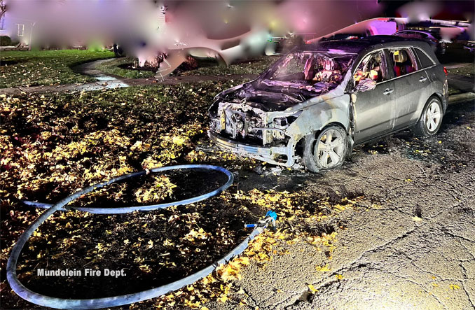 Car fire in Mundelein likely caused by ignition of leaves from the heat from the catalytic converter and  exhaust system on Sunday night, November 19, 2023 (SOURCE: Mundelein Fire Department)