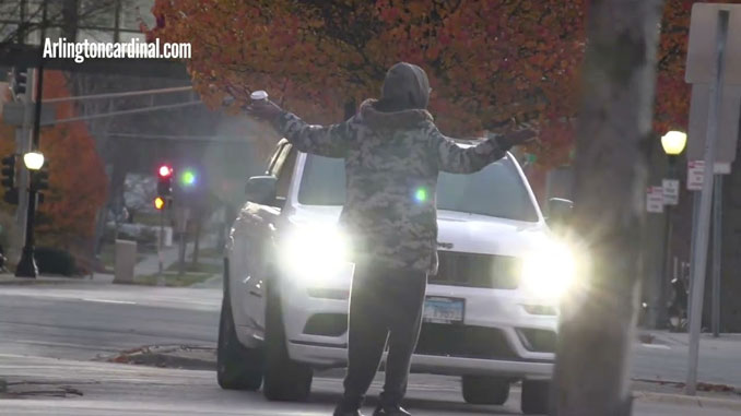 Taunting motorists in traffic on Northwest Highway near Miner Street, Sunday, November 19, 2023 about 6:30 a.m.